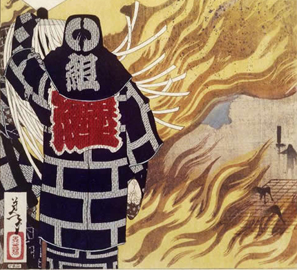 A flagbearer matoimochi holding tight to his pole as the fire rages around him