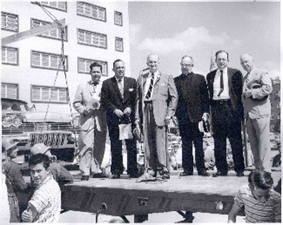 Dignitaries pose in front of the camera