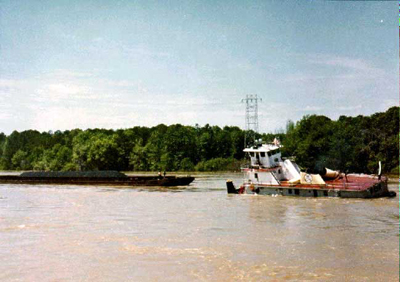 The M/V Cahaba approaches the barges it had let go